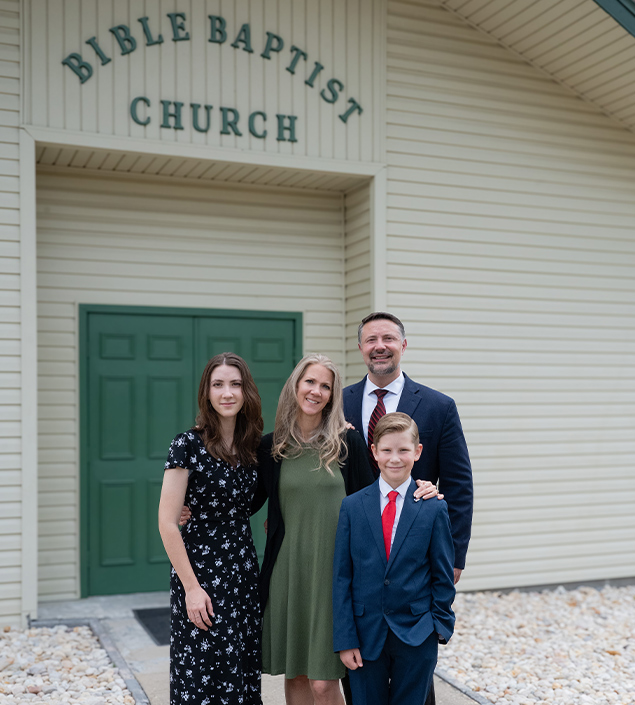 photo of pastor family in front of church